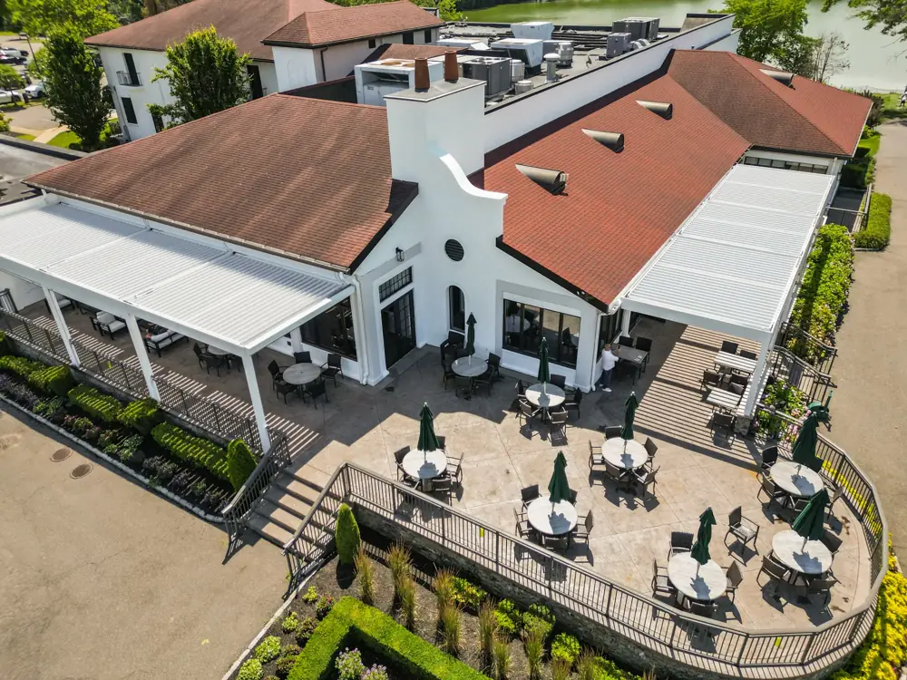 Country club wide aerial with multi-bay louvered roof